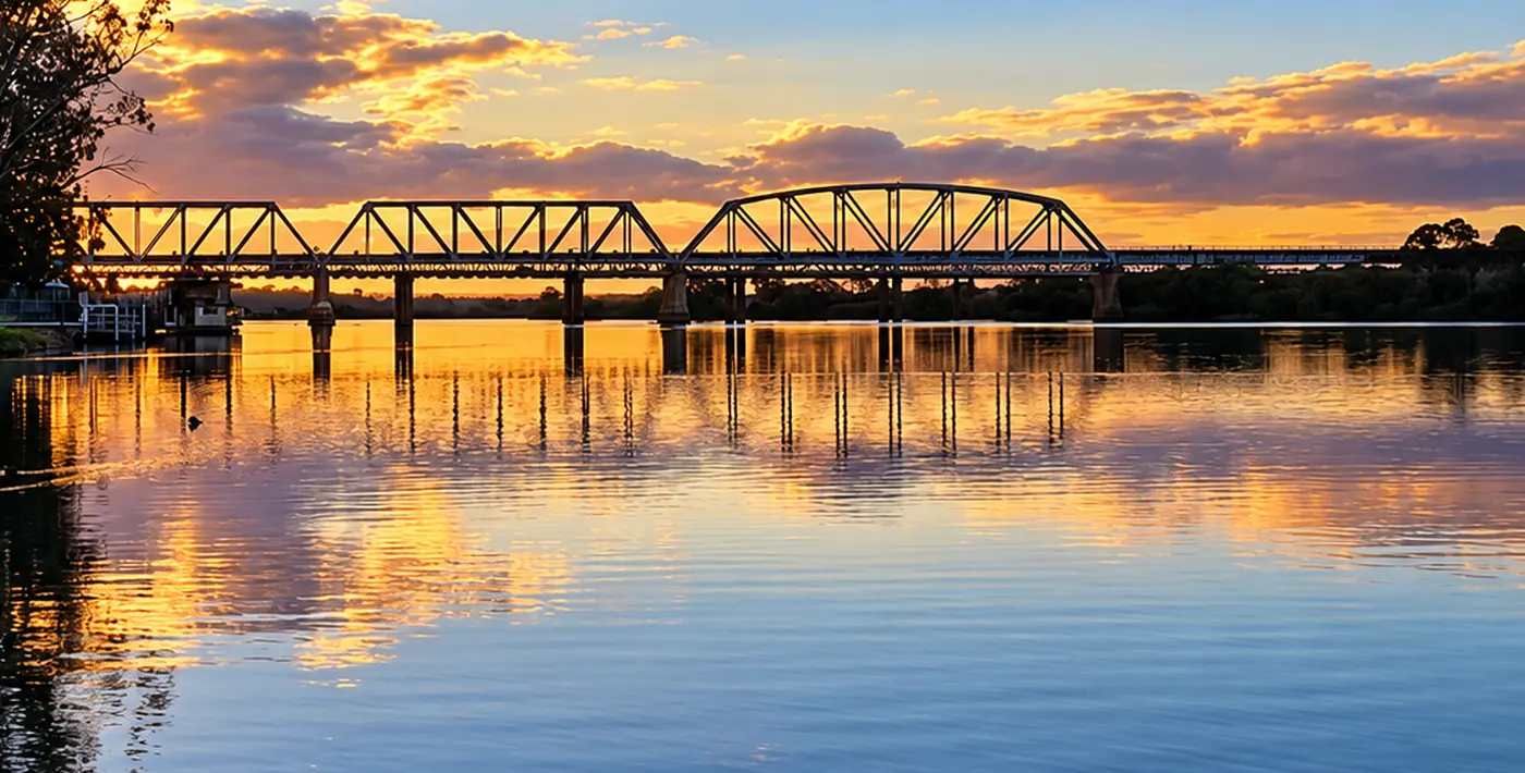 The Murray River rail bridge at golden hour