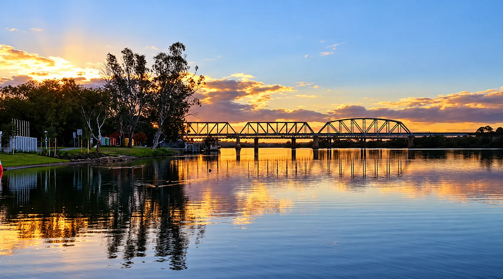 Sunset over the Murray River rail bridge at Murray Bridge